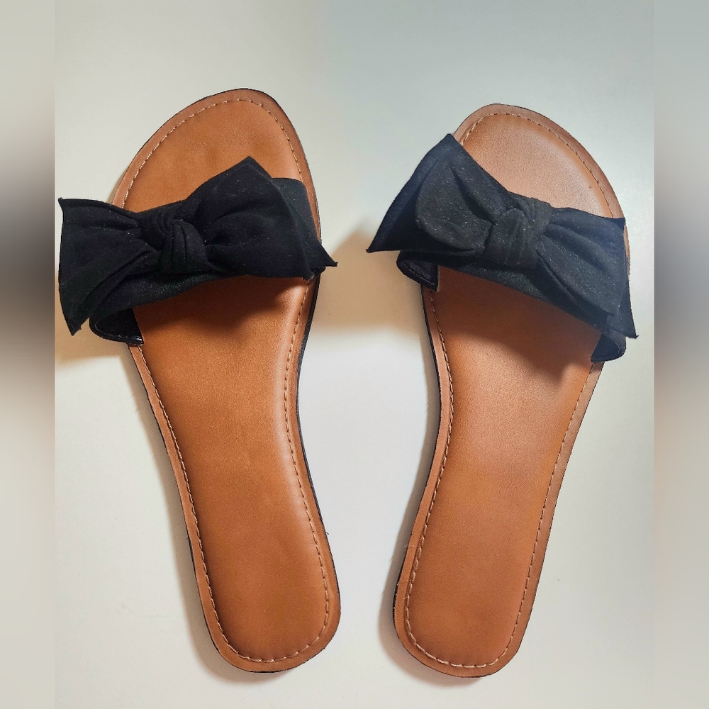 Flat black bow slip on sandals